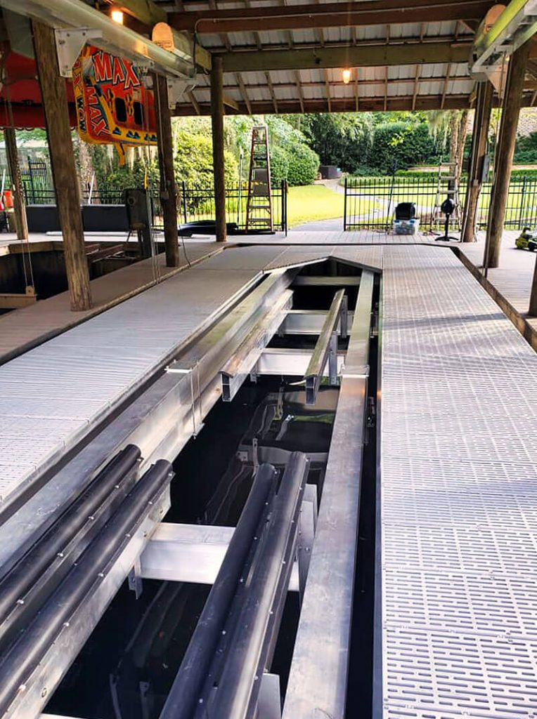 Large wooden boathouse features IMM Quality Superlift deck lift