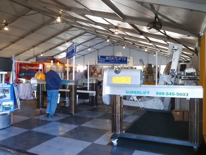 Shoppers circulation through the IMM Quality Boat Lifts booth at the Miami International Boat Show