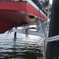 Working With Boat Lift Manufacturers resulted in custom bunks on this titan yacht lift