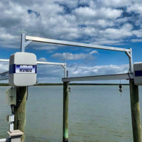 Elevated spreader brackets with 300 dpi bunk systems and cradle for boat lift