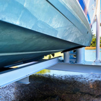 Side view of large Titan yacht lift by IMM Quality Boat Lifts features powder coated cradles